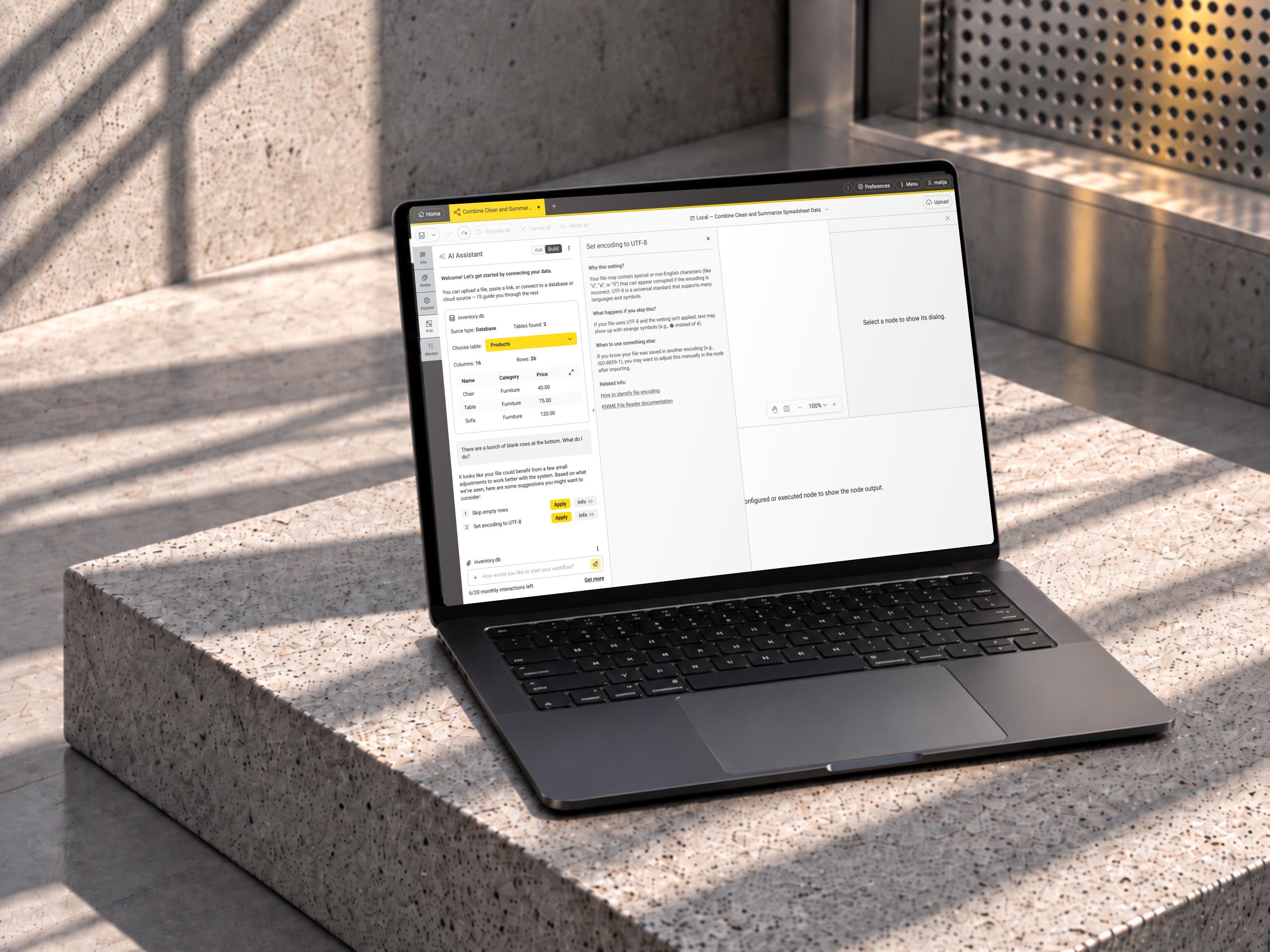 A MacBook on a sunlit concrete ledge displaying the KNIME AI assistant with a database preview and an explanation side panel.